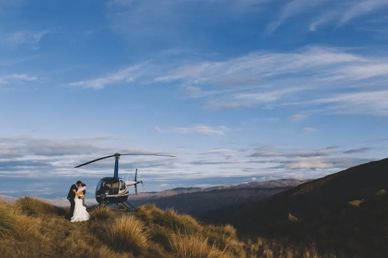 Home 7 Bride and Groom kissing for their Queenstown Heli Wedding photo at Roy's Peak
